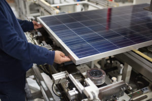 man working in solar factory